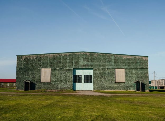 Green barracks and mess hall at Base31