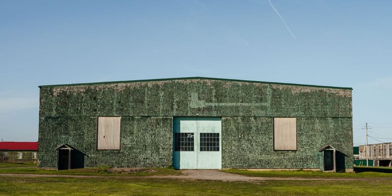 Green barracks and mess hall at Base31